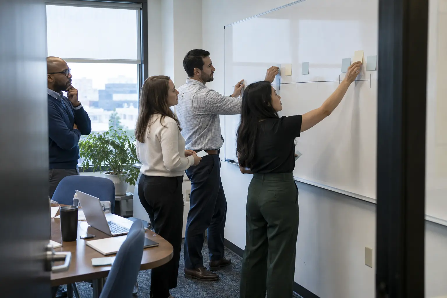 A team maps the steps of a standard office procedure.