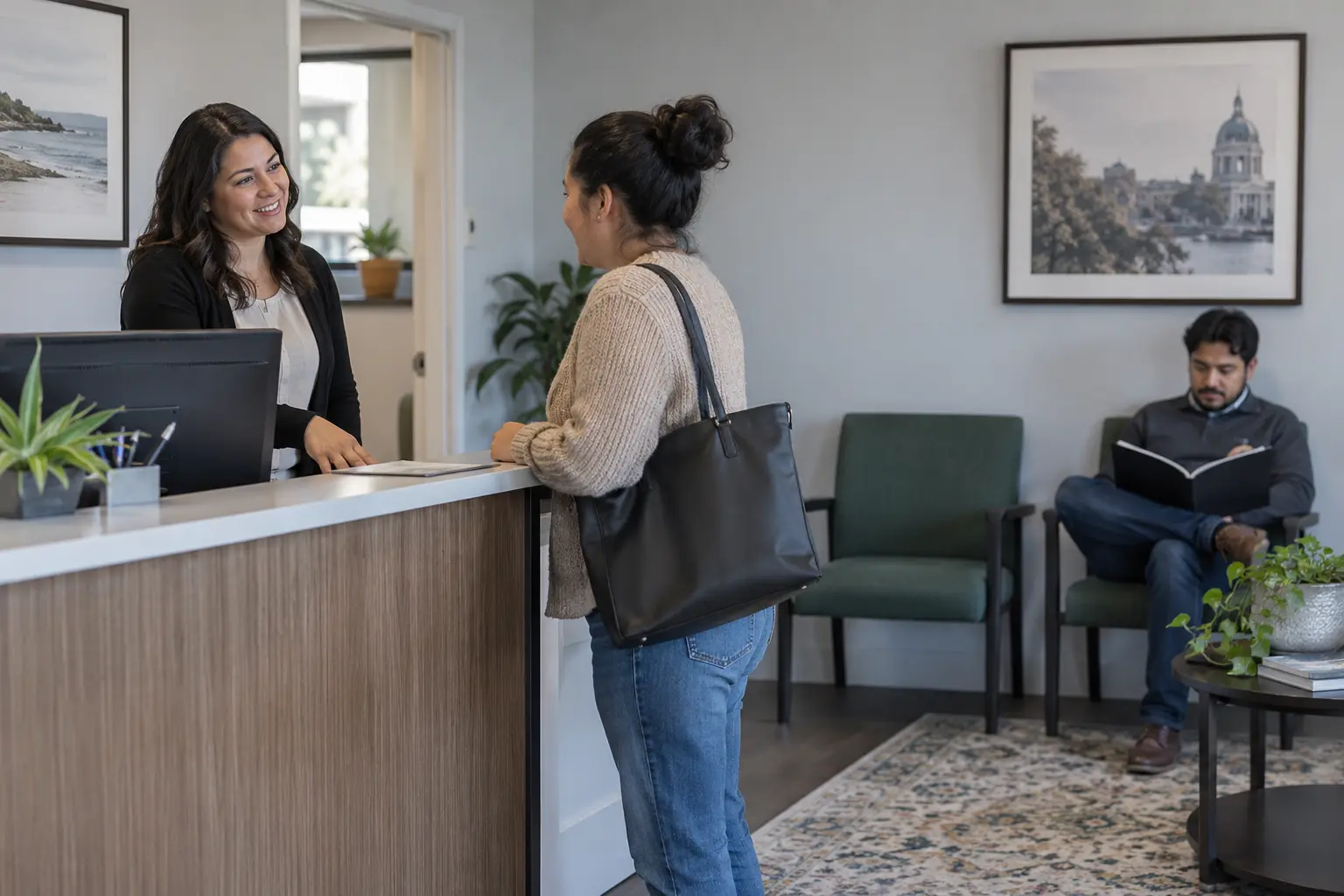 A reception coordinator welcomes a client to a law office.