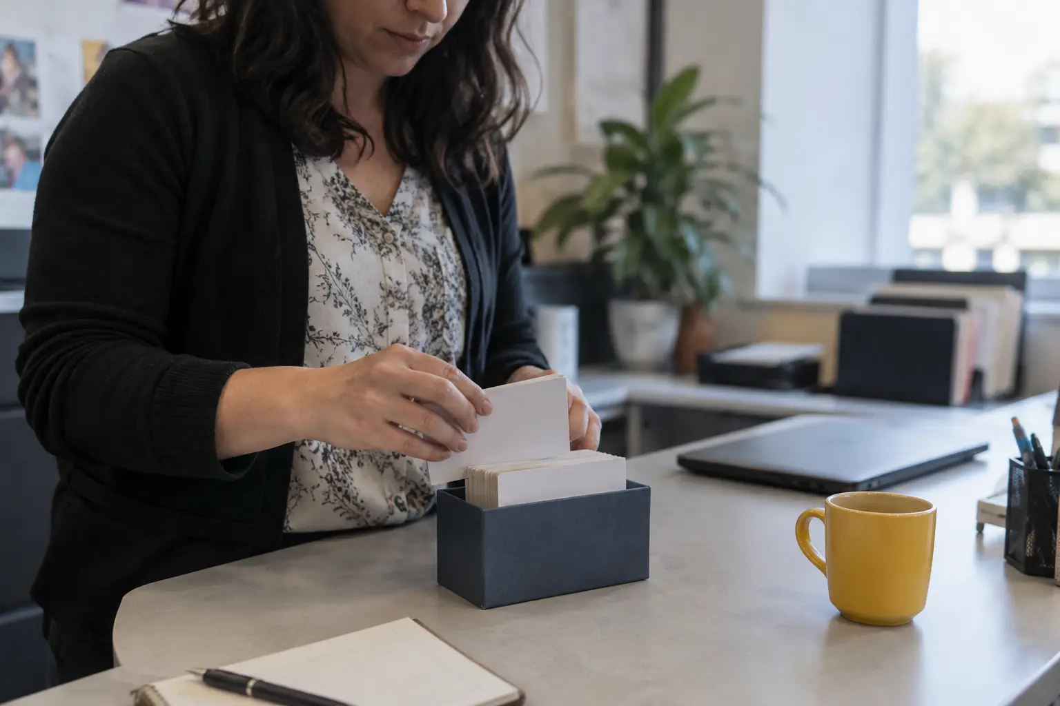 An office coordinator organizes client contact records.