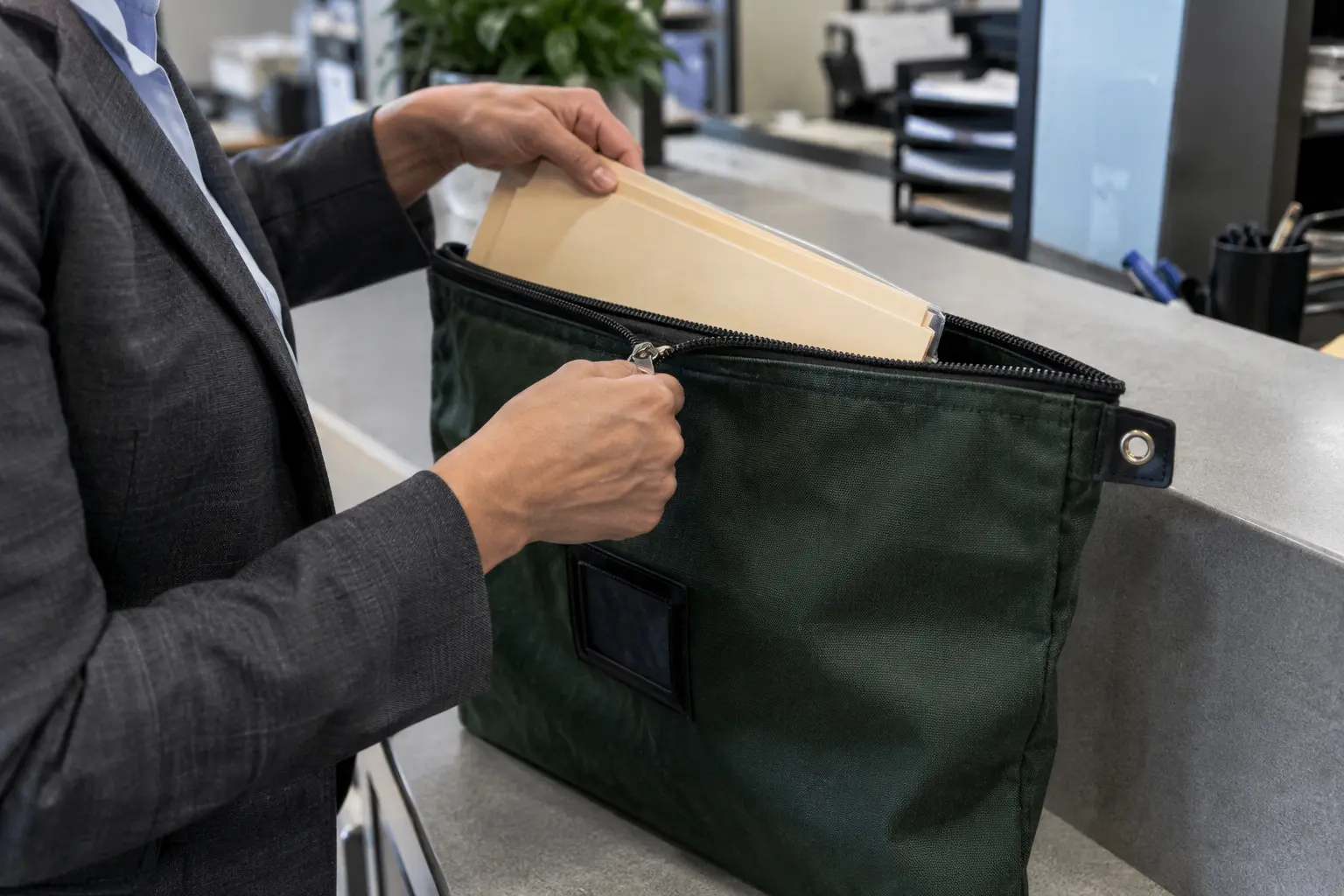 An attorney secures a case file in a lockable pouch.